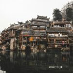 brown wooden houses beside river